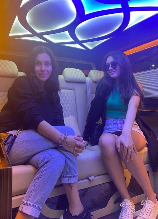 Happy Side Taxi customers in a VIP van